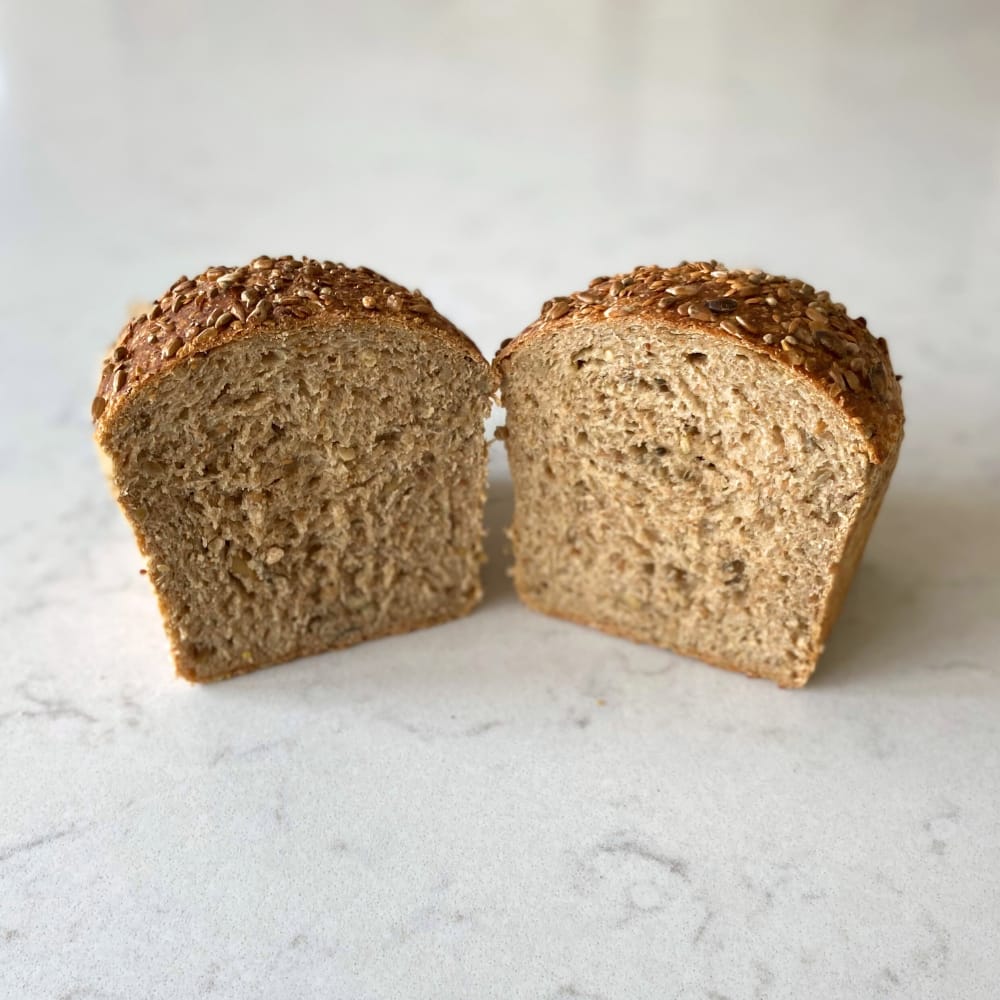 Seedy Sourdough Tin Loaf cut through the middle to show the crumb